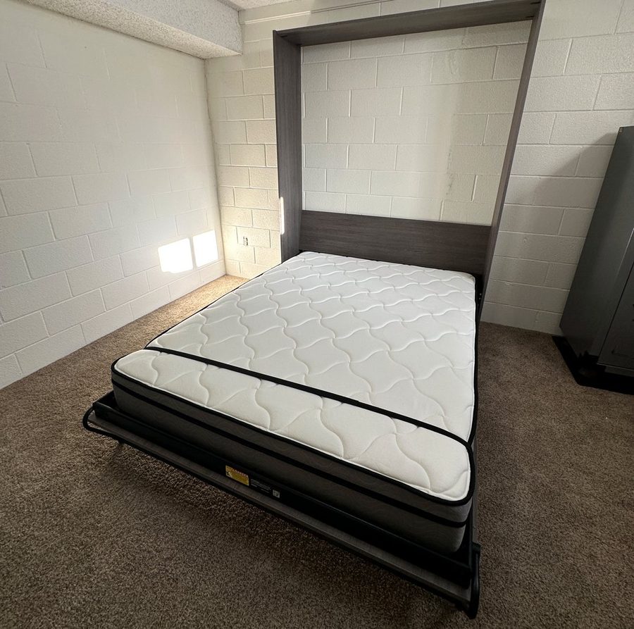 Wall bed folded down with mattress